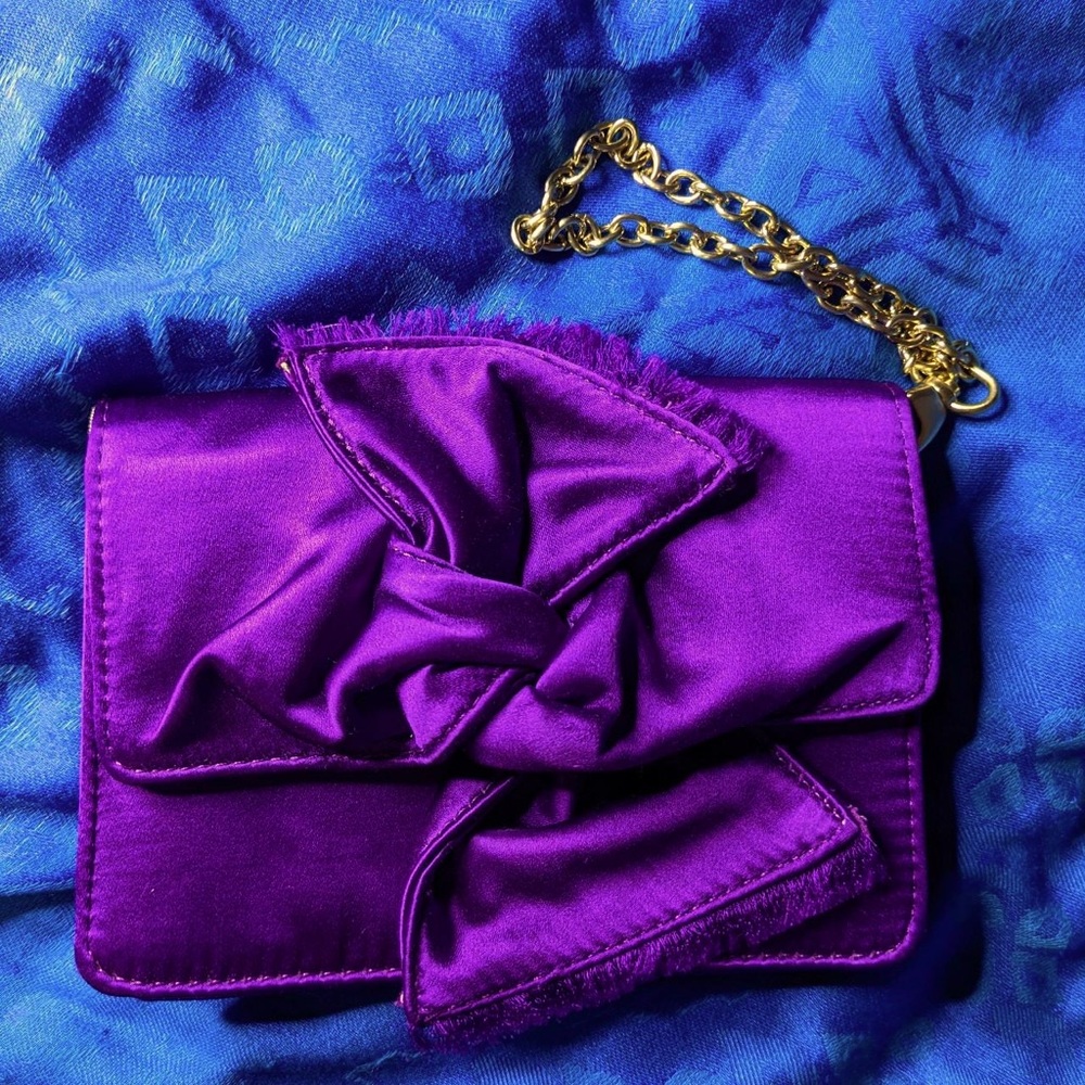 Satin wristlet by BCBG